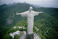 Cristo Redentor (Christ the Redeemer) opens his arms wide as if to embrace all of Rio de Janeiro